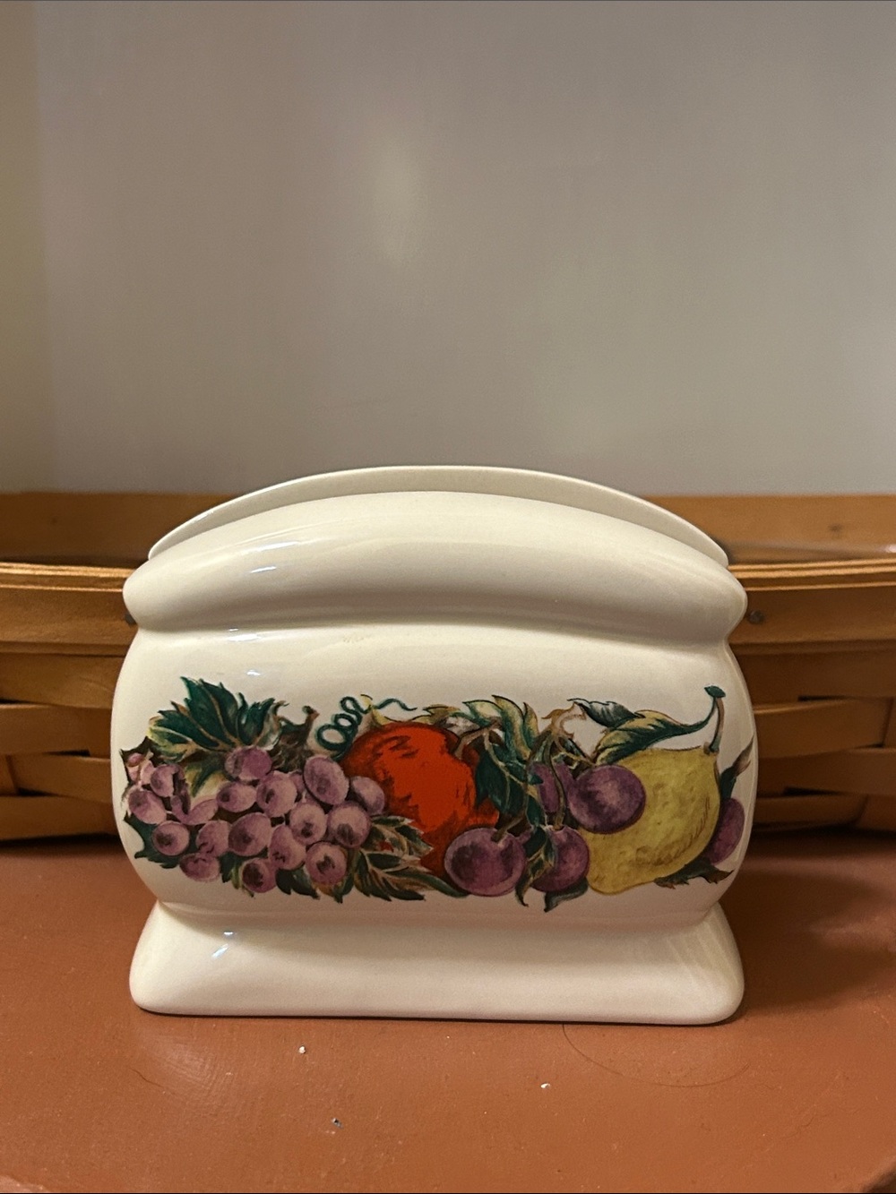 VTG Cornucopia ceramic napkin holder featuring a colorful raised fruit mot
